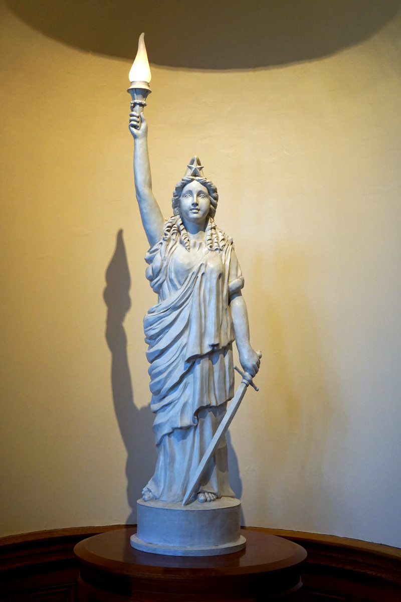 Stone statue of lady liberty